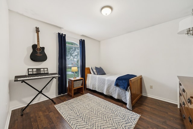 312 Bluffview Ct, Forney, TX 75126 - bedroom featuring dark wood-type flooring and baseboards