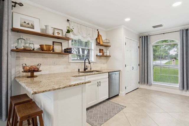 312 Bluffview Ct, Forney, TX 75126 - kitchen featuring dishwasher, open shelves, crown molding, backsplash, and light stone countertops
