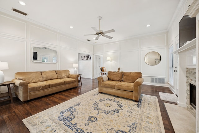 312 Bluffview Ct, Forney, TX 75126 - living room with a decorative wall, ceiling fan, a premium fireplace, dark wood finished floors, and ornamental molding