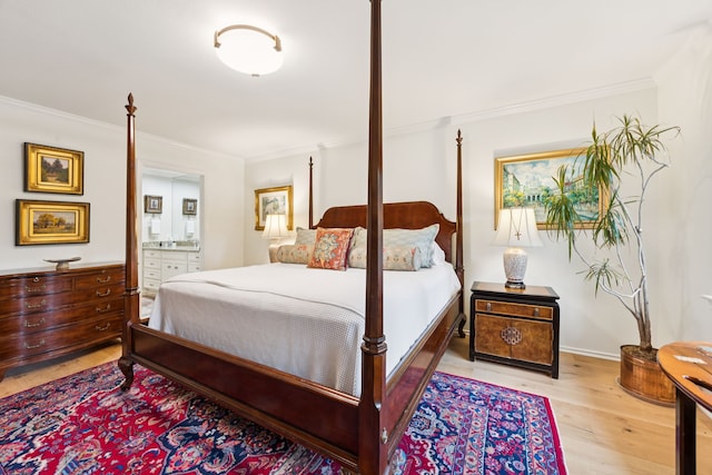 6227 Bandera Ave Unit D, Dallas, TX 75225 - bedroom with ornamental molding, light wood finished floors, and connected bathroom