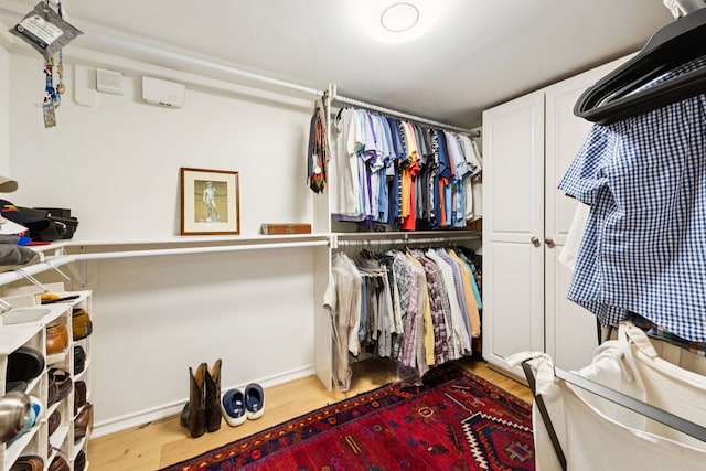 6227 Bandera Ave Unit D, Dallas, TX 75225 - walk in closet with wood finished floors