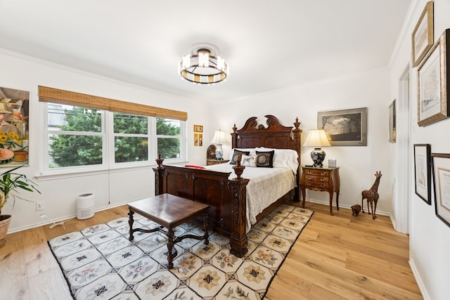 6227 Bandera Ave Unit D, Dallas, TX 75225 - bedroom with light wood-style flooring and crown molding