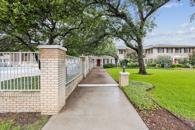 6227 Bandera Ave Unit D, Dallas, TX 75225 - view of community with a fenced front yard, a swimming pool, and a gate