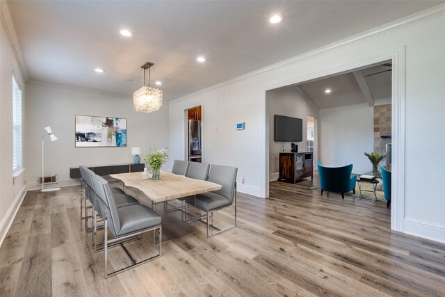 11329 Mccree Rd, Dallas, TX 75238 - dining area featuring light wood finished floors, crown molding, recessed lighting, a chandelier, and vaulted ceiling