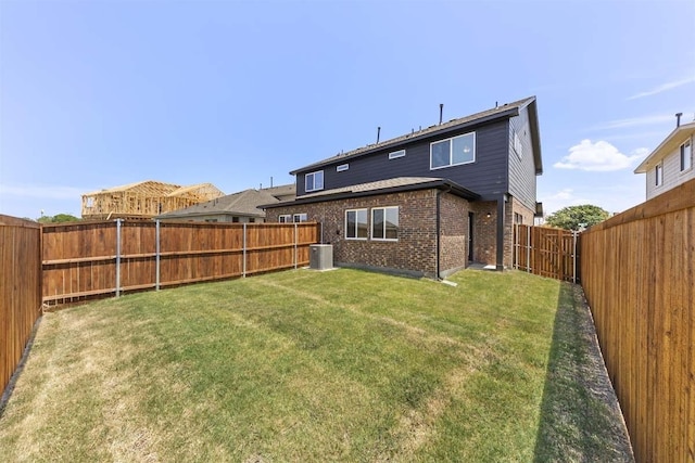 212 Griffith Dr, Princeton, TX 75407 - rear view of property featuring brick siding and a fenced backyard