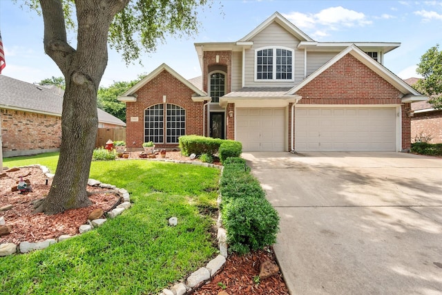 2213 Laura Elizabeth Trl, Mansfield, TX 76063 - traditional home with brick siding, driveway, a front yard, and a garage