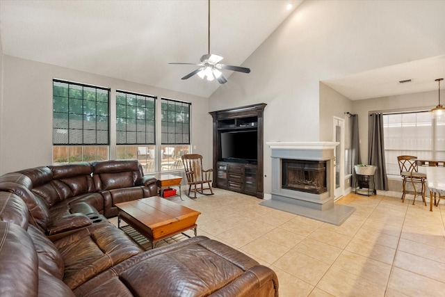 2213 Laura Elizabeth Trl, Mansfield, TX 76063 - living room featuring a ceiling fan, a multi sided fireplace, light tile patterned flooring, and high vaulted ceiling