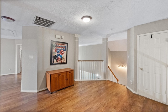 2213 Laura Elizabeth Trl, Mansfield, TX 76063 - empty room with light wood-type flooring and a textured ceiling