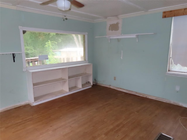 9066 Orinoco Dr, Dallas, TX 75217 - spare room featuring ornamental molding, wood finished floors, and ceiling fan