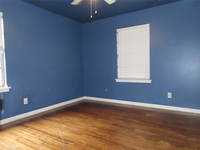 9066 Orinoco Dr, Dallas, TX 75217 - spare room featuring ceiling fan and wood-type flooring