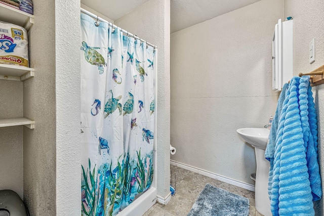 509 W Reynosa Ave, De Leon, TX 76444 - full bathroom featuring a shower with curtain and tile patterned floors