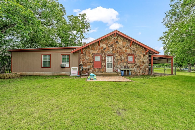 509 W Reynosa Ave, De Leon, TX 76444 - back of property with stone siding, a patio area, and cooling unit