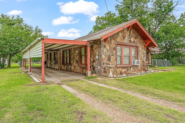 509 W Reynosa Ave, De Leon, TX 76444 - view of front of property with stone siding, driveway, and a carport