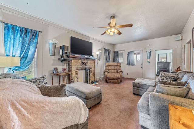 509 W Reynosa Ave, De Leon, TX 76444 - carpeted living area with ornamental molding, a ceiling fan, and a fireplace
