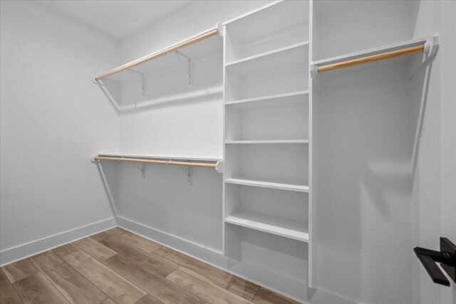 13017 Rainier, Woodway, TX 76712 - walk in closet with wood finished floors