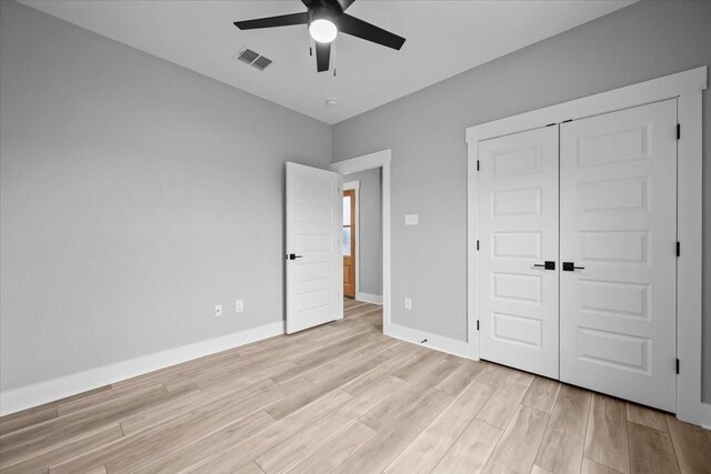 13017 Rainier, Woodway, TX 76712 - unfurnished bedroom featuring light wood-type flooring, a closet, and ceiling fan