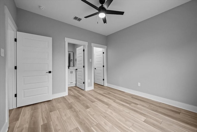 13017 Rainier, Woodway, TX 76712 - unfurnished bedroom with light wood-style flooring, ensuite bathroom, and a ceiling fan