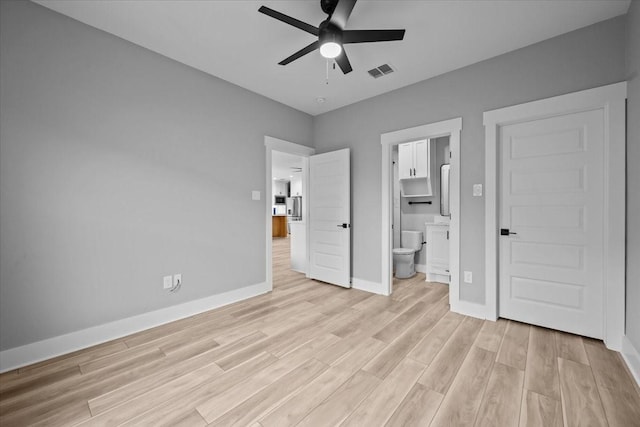 13017 Rainier, Woodway, TX 76712 - unfurnished bedroom featuring light wood finished floors, ensuite bath, and a ceiling fan