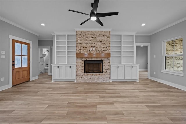 13017 Rainier, Woodway, TX 76712 - unfurnished living room with crown molding, ceiling fan, recessed lighting, a fireplace, and light wood-style flooring