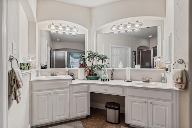 4105 Claridge Ter, Garland, TX 75043 - full bathroom with a stall shower, double vanity, and tile patterned flooring