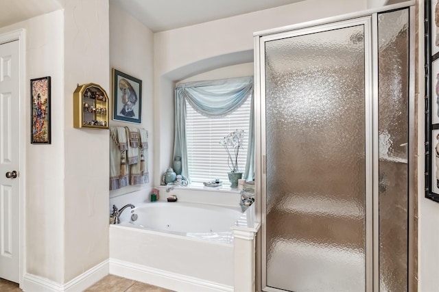 4105 Claridge Ter, Garland, TX 75043 - bathroom with a stall shower, a jetted tub, tile patterned floors, and plenty of natural light