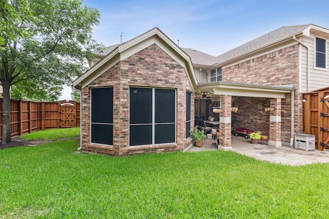 4105 Claridge Ter, Garland, TX 75043 - rear view of house featuring brick siding, a patio, a fenced backyard, and a gate