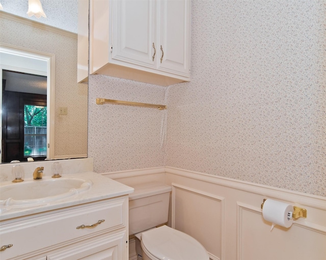 748 Arbor Creek Dr, Desoto, TX 75115 - half bathroom featuring wallpapered walls, a wainscoted wall, and vanity