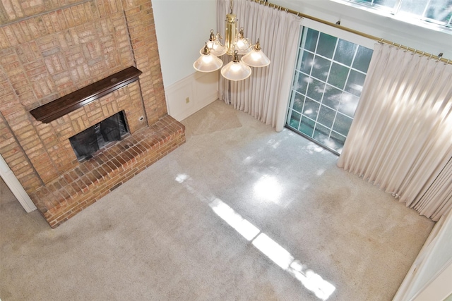 748 Arbor Creek Dr, Desoto, TX 75115 - unfurnished living room with carpet, a fireplace, and a chandelier