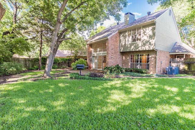748 Arbor Creek Dr, Desoto, TX 75115 - back of house featuring brick siding, a chimney, and a patio area