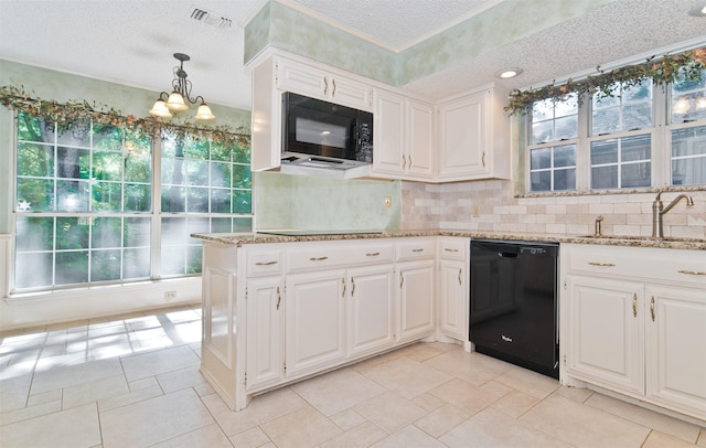 748 Arbor Creek Dr, Desoto, TX 75115 - kitchen with black appliances, decorative backsplash, light stone counters, a textured ceiling, and white cabinets