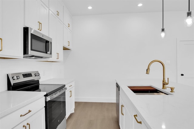 408 Grayson, Leonard, TX 75452 - kitchen with appliances with stainless steel finishes, light wood-type flooring, light countertops, and recessed lighting