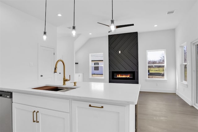 408 Grayson, Leonard, TX 75452 - kitchen with dishwasher, a large fireplace, open floor plan, white cabinetry, and recessed lighting