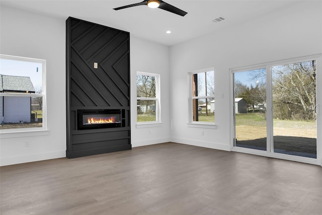 408 Grayson, Leonard, TX 75452 - unfurnished living room featuring a fireplace, a ceiling fan, wood finished floors, and recessed lighting