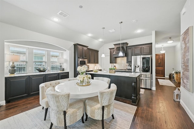 1008 Snowbird Dr, Little Elm, TX 75068 - dining space featuring dark wood-style flooring, vaulted ceiling, and recessed lighting