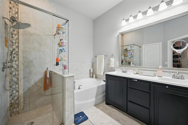 1008 Snowbird Dr, Little Elm, TX 75068 - full bathroom featuring a shower stall, a bath, double vanity, and tile patterned flooring