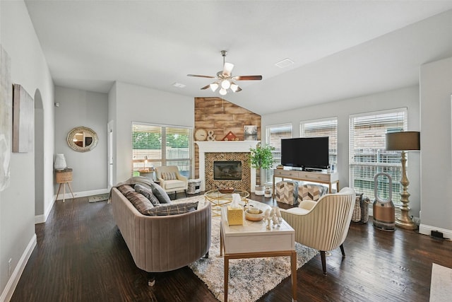 1008 Snowbird Dr, Little Elm, TX 75068 - living area with vaulted ceiling, ceiling fan, wood finished floors, a fireplace, and arched walkways