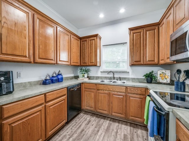 400 Autry Blvd, Gunter, TX 75058 - kitchen with dishwasher, white electric stove, stainless steel microwave, brown cabinetry, and light wood-type flooring