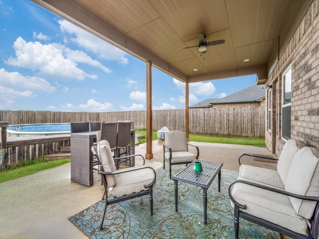 400 Autry Blvd, Gunter, TX 75058 - fenced backyard with a patio, ceiling fan, and an outdoor hangout area