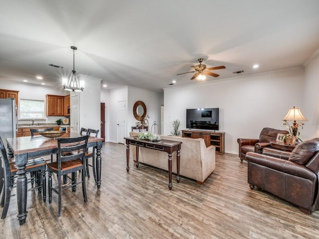 400 Autry Blvd, Gunter, TX 75058 - living room with a ceiling fan, recessed lighting, light wood-style flooring, and ornamental molding