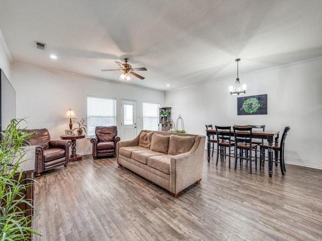 400 Autry Blvd, Gunter, TX 75058 - living room featuring crown molding, a ceiling fan, wood finished floors, a chandelier, and recessed lighting
