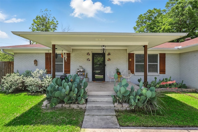 209 Walnut St, Sanger, TX 76266 - view of front of property with covered porch and brick siding