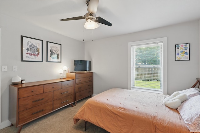 209 Walnut St, Sanger, TX 76266 - bedroom with multiple windows, light carpet, and ceiling fan