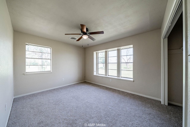 2306 County Road 475, Anson, TX 79501 - unfurnished bedroom featuring carpet flooring and a ceiling fan