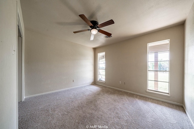 2306 County Road 475, Anson, TX 79501 - carpeted empty room with a ceiling fan and baseboards