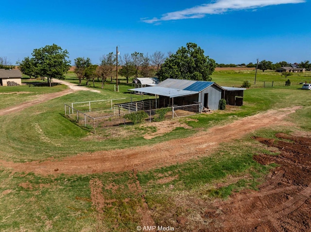 2306 County Road 475, Anson, TX 79501 - exterior space featuring an outdoor structure, an exterior structure, a rural view, and dirt driveway