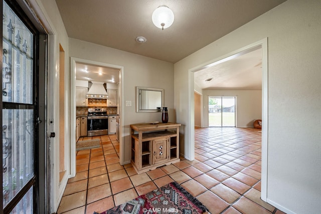 2306 County Road 475, Anson, TX 79501 - hallway featuring light tile patterned floors and baseboards