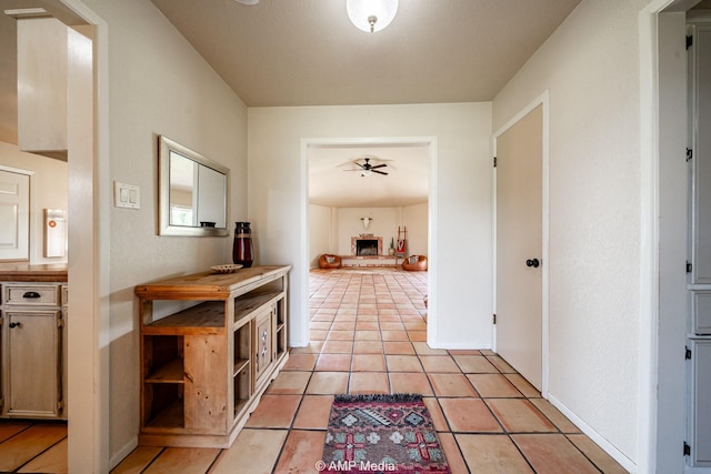 2306 County Road 475, Anson, TX 79501 - corridor with light tile patterned floors and baseboards