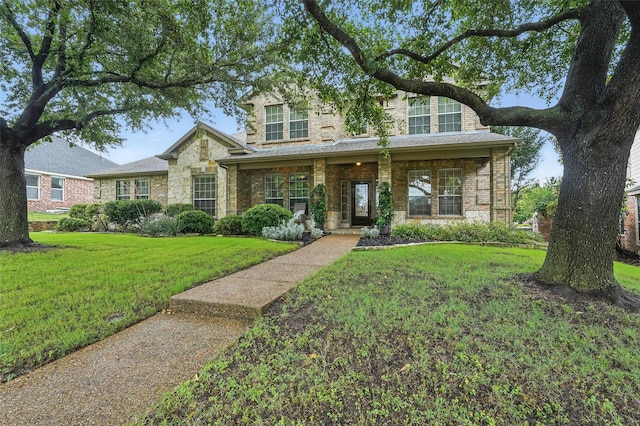 1330 Scarboro Hills Ln, Rockwall, TX 75087 - traditional home with a front yard, stone siding, and brick siding