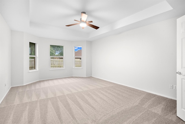 908 Trinity Dr, Lancaster, TX 75146 - empty room featuring a raised ceiling, carpet flooring, and ceiling fan