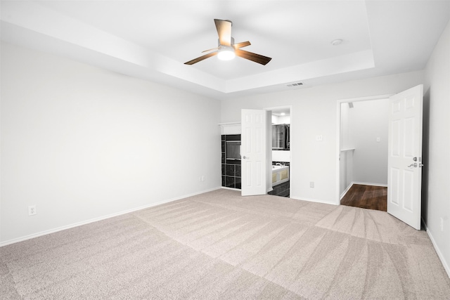 908 Trinity Dr, Lancaster, TX 75146 - unfurnished bedroom with a raised ceiling, carpet floors, and ceiling fan